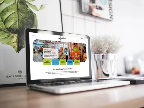 Impressie van homepage Van Houten & Co op een scherm.