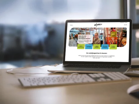 Impressie van homepage Van Houten & Co op een scherm.