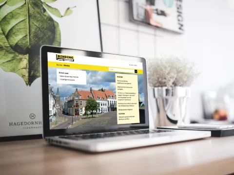 Impressie van homepage Stichting Binding op een scherm.