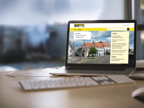 Impressie van homepage Stichting Binding op een scherm.